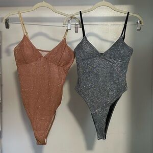 Sparkle body suits. Never worn.